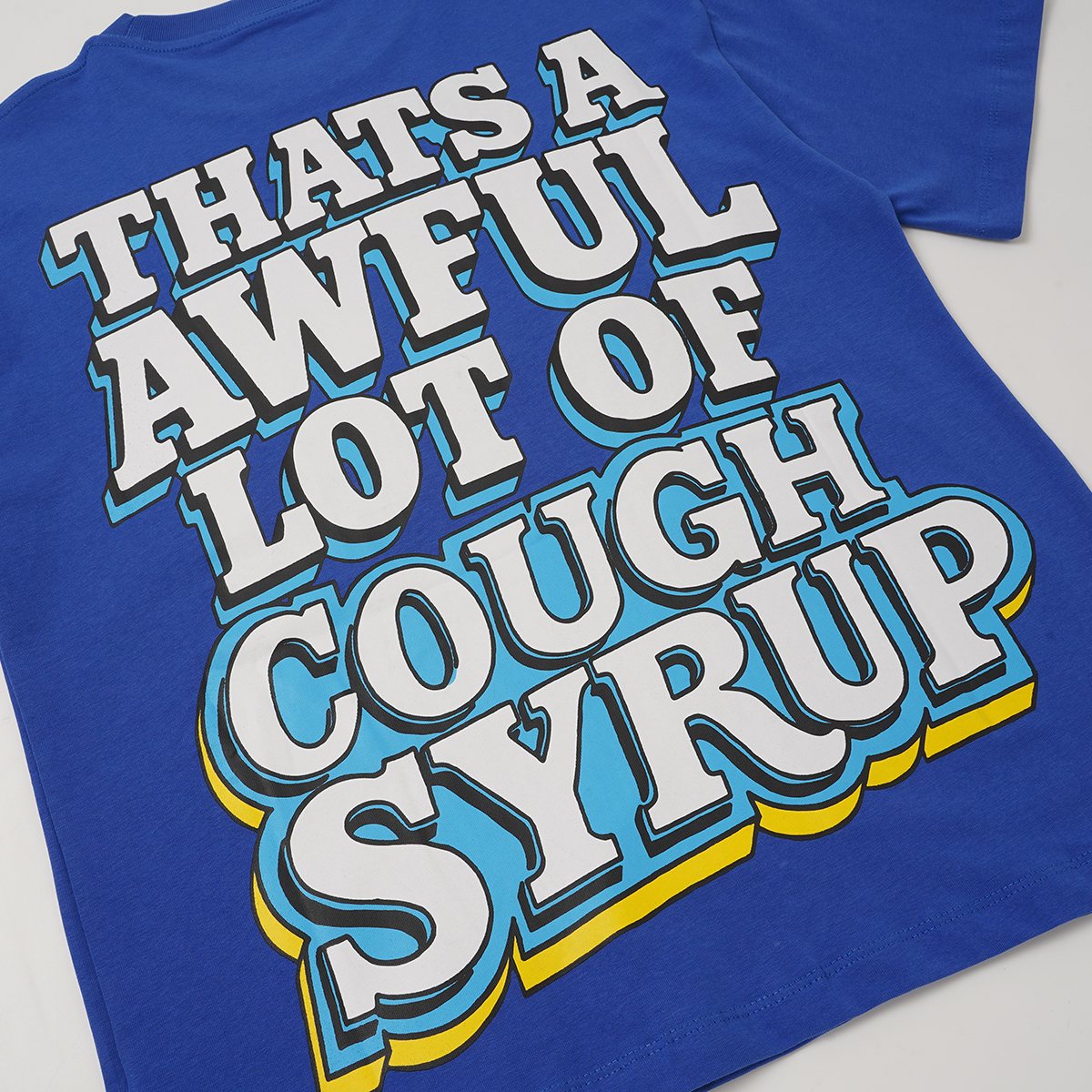 THAT'S A AWFUL LOT OF COUGH SYRUP Cartoon Graphic T-Shirt — detail
